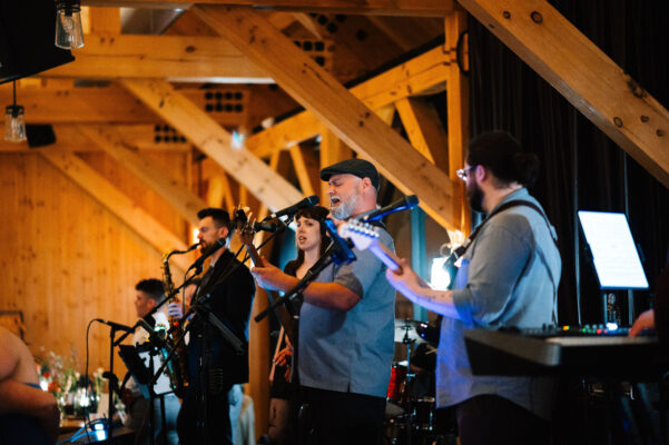 Live band singing and playing in the events pavilion