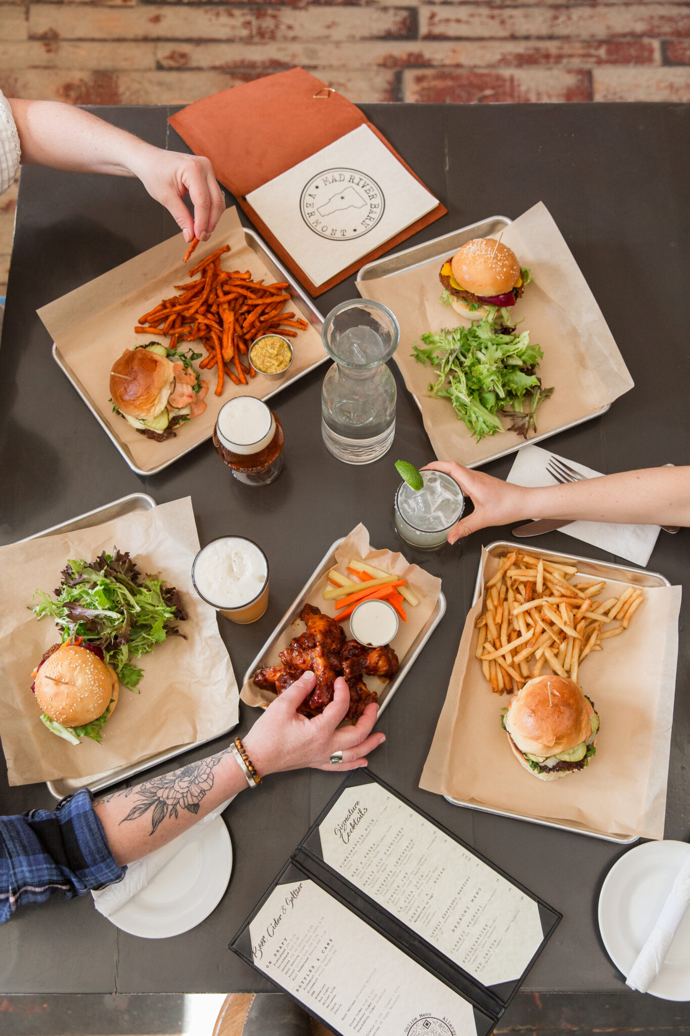 above action shot of three ladies eating their dinner