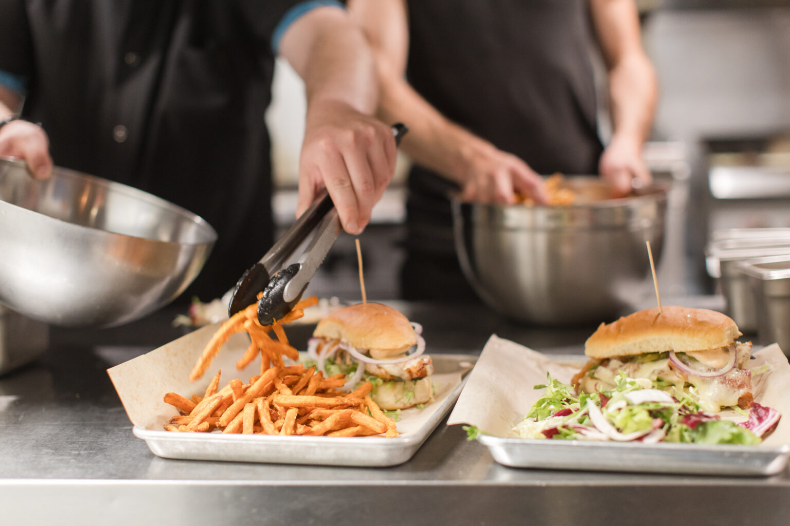 Mad River Barn chicken sandwiches being plated up by the kitchen and going out to hungry customers