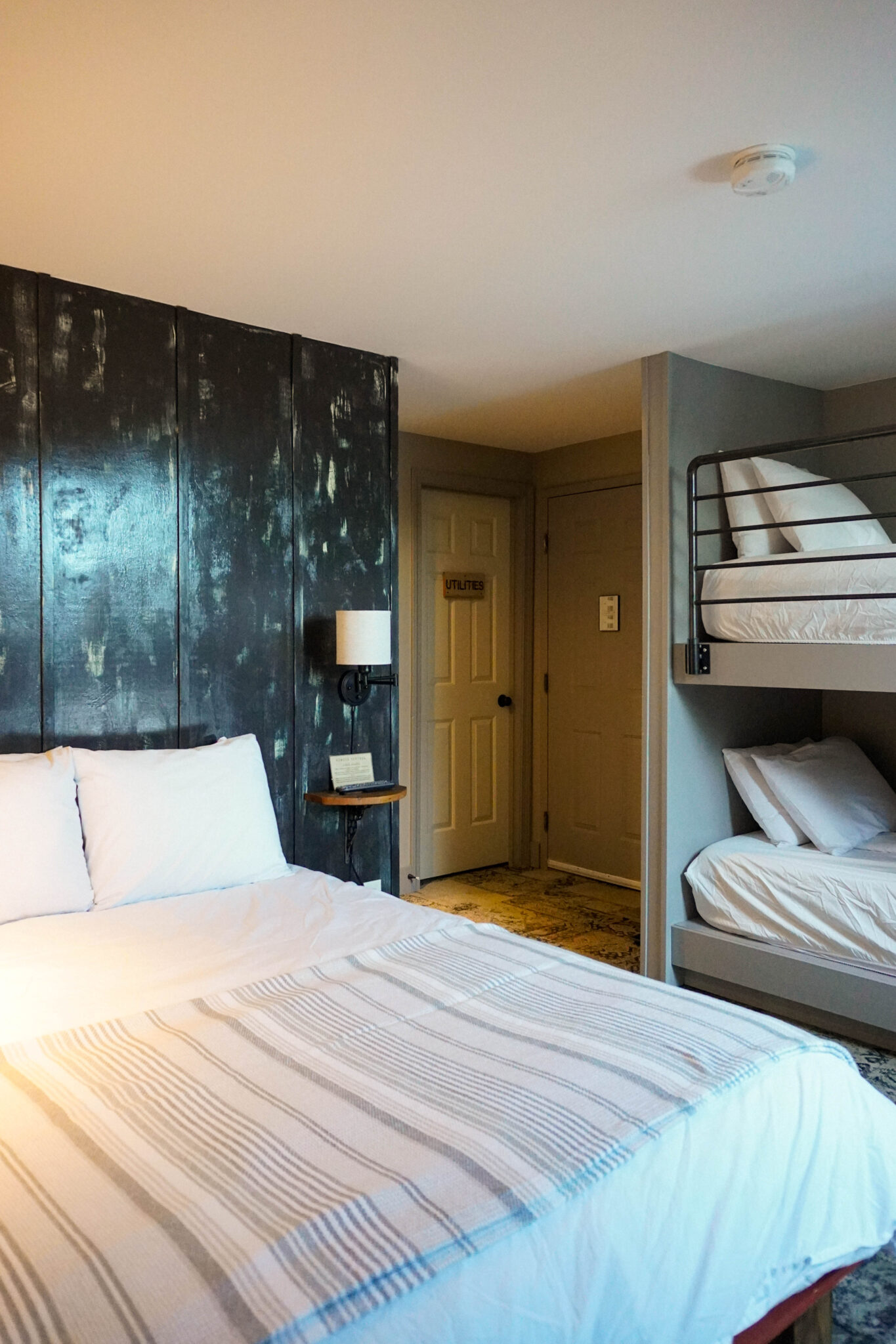 An Image of our Annex Room "A3" which has 1 queen bed and 2 twin beds, bunk style